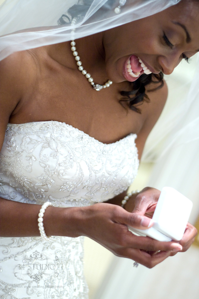 brides gets happy when she sees the present