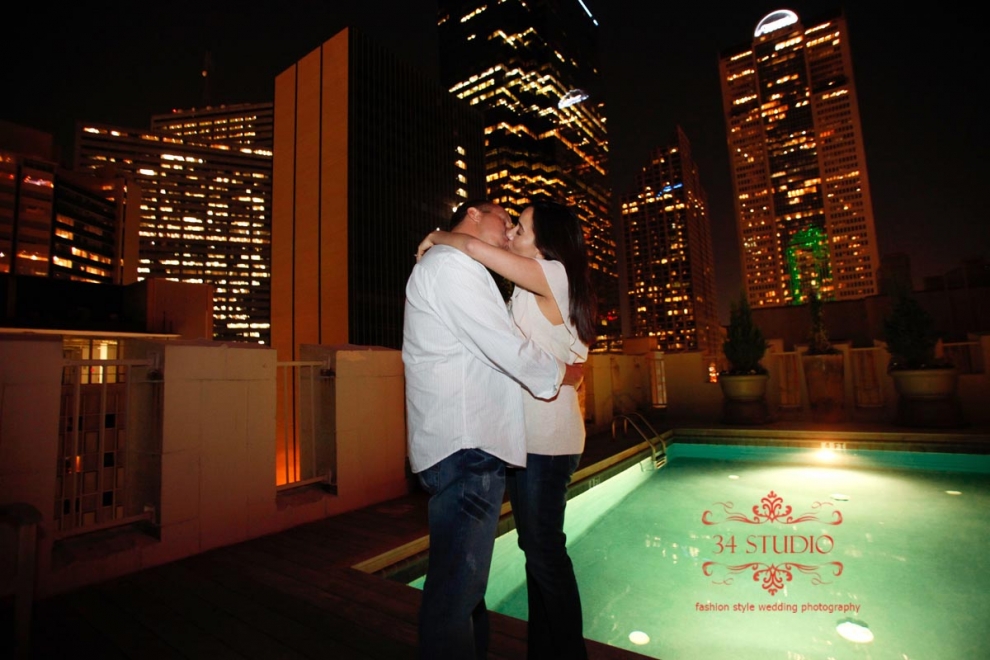 dallas skyline engagement photo on the roof