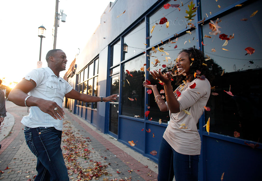 couple playing with leaves in deep ellum downtown dallas