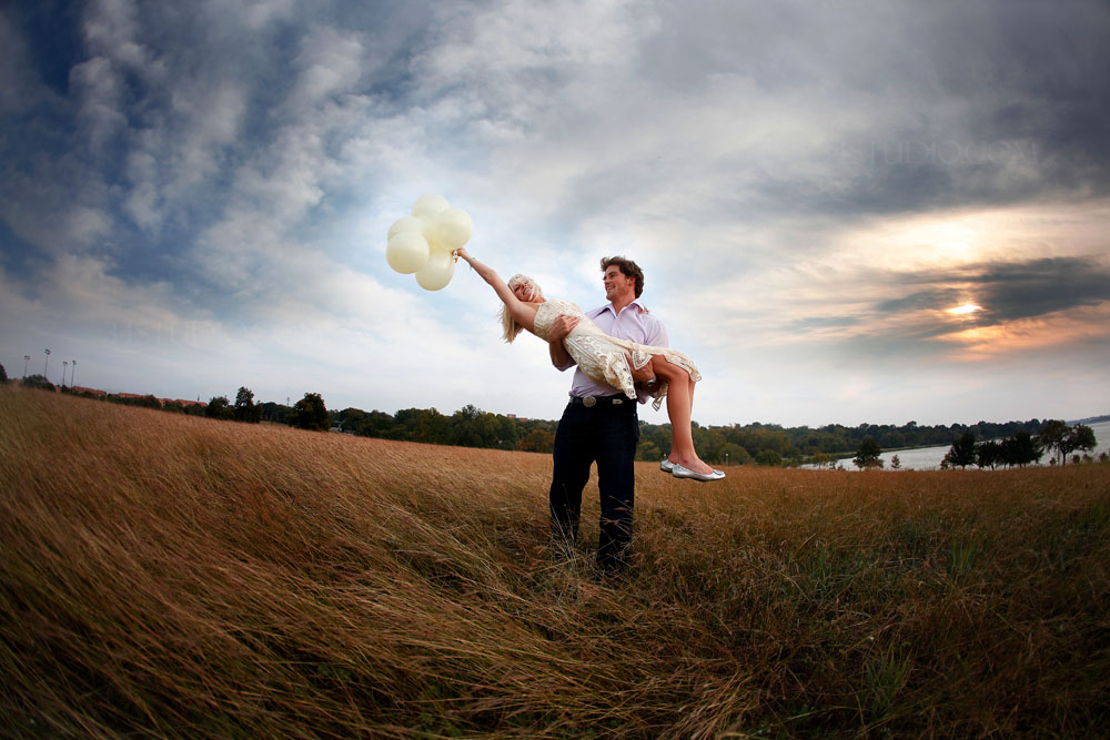 baloons and couple having fun engagement shot at white rock lake