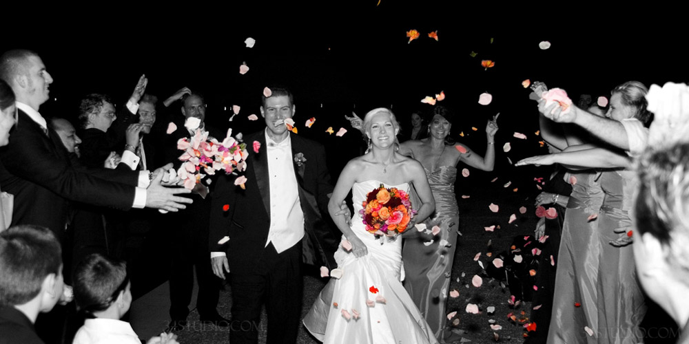 getting away from wedding black and while with color rose pedals